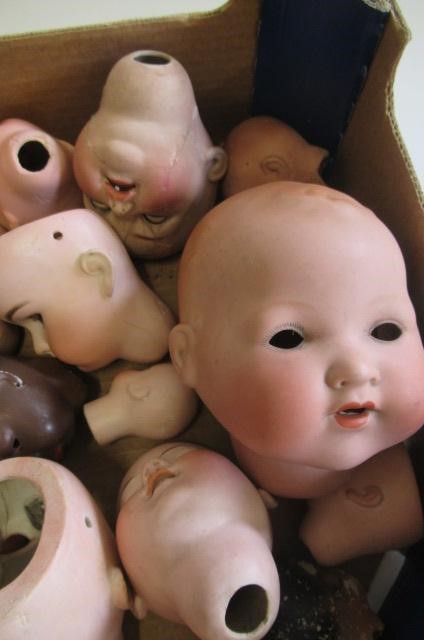 Thirty bisque dolls heads Image