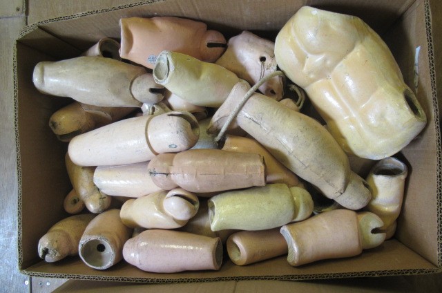 Three boxes of doll spares Image