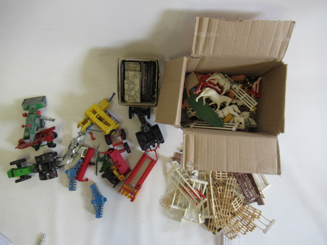 Playworn Britains farm vehicles and accessories including tractors and trailers Image