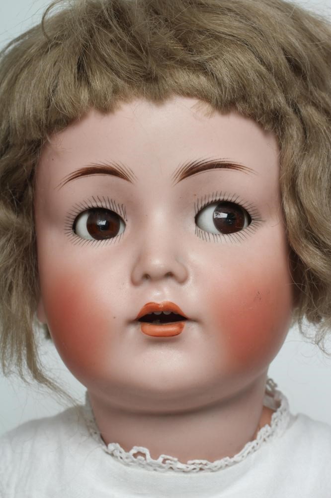 A Kammer & Reinhardt bisque socket head flirty doll Image