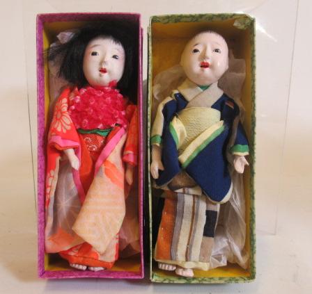 A pair of boxed oriental Moschemon dolls Image