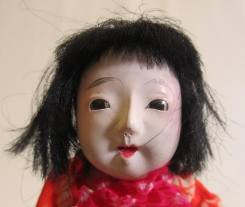 A pair of boxed oriental Moschemon dolls Image