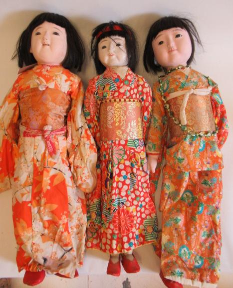 Three large oriental dolls Image