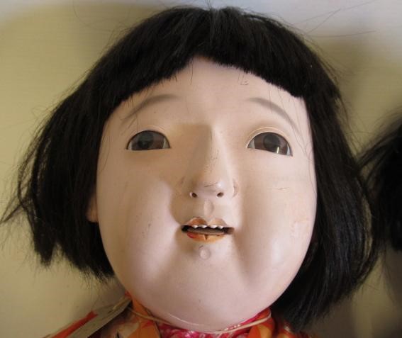 Three large oriental dolls Image