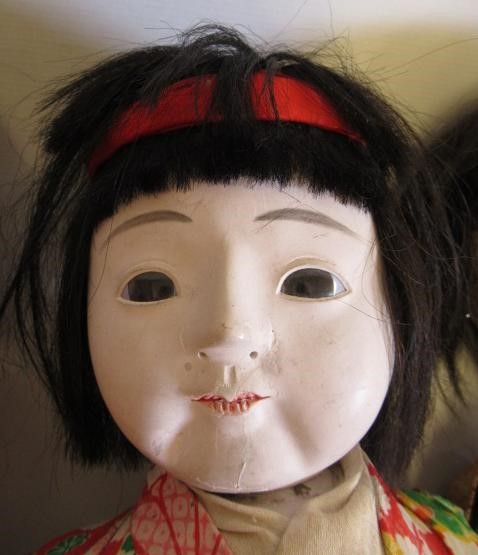 Three large oriental dolls Image