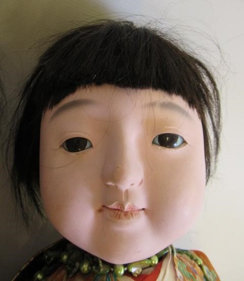 Three large oriental dolls Image