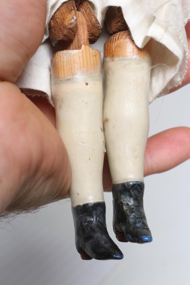 A Victorian wax shoulder head doll Image