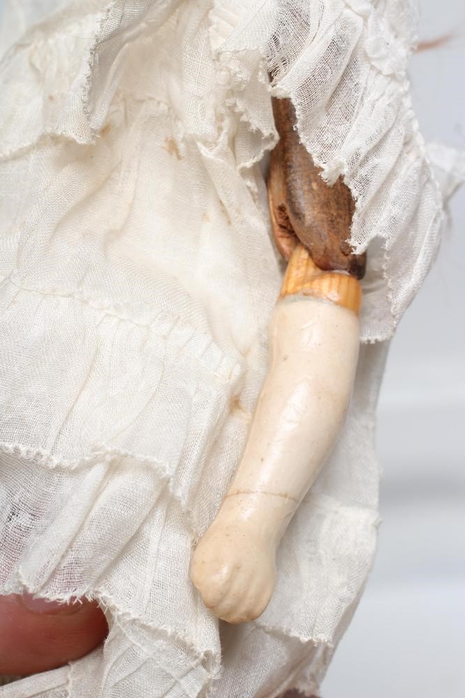 A Victorian wax shoulder head doll Image