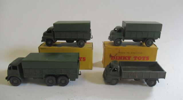 Four Dinky army vehicles comprising three 3-ton wagons and a 10-ton wagon Image