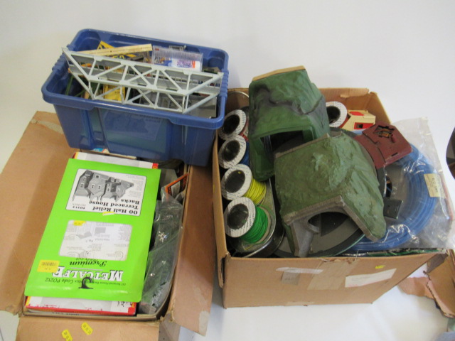 A large quantity of playworn trackside scenic accessories including station buildings Image