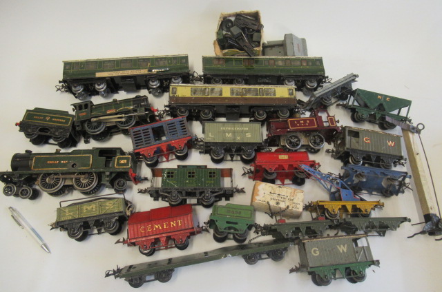 Playworn Hornby rolling stock including three clockwork locomotives Image