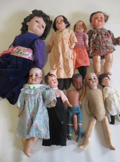 A collection of nine bisque head dolls Image