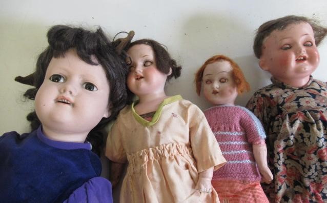 A collection of nine bisque head dolls Image