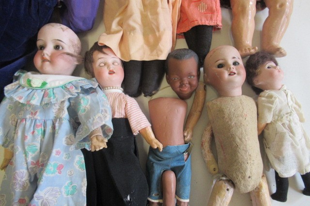 A collection of nine bisque head dolls Image