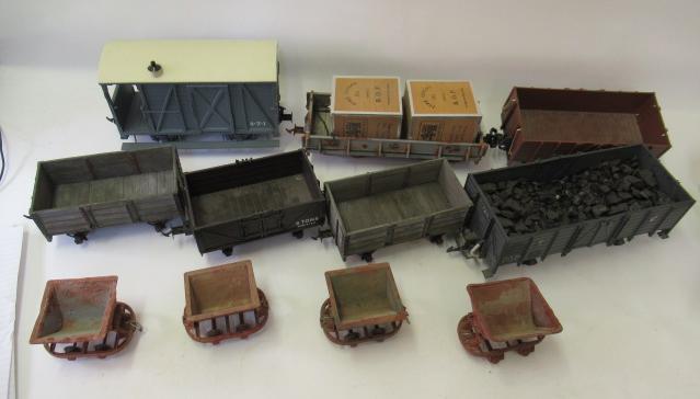 Seven plastic and wooden 45mm Narrow gauge goods trucks and four tipping hopper trucks Image