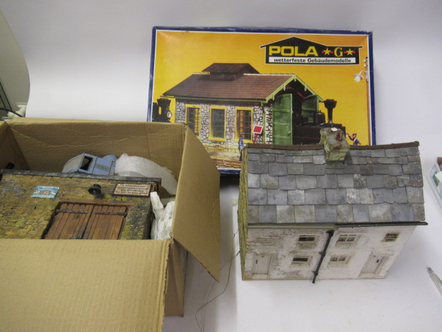 Three G scale buildings comprising house Image