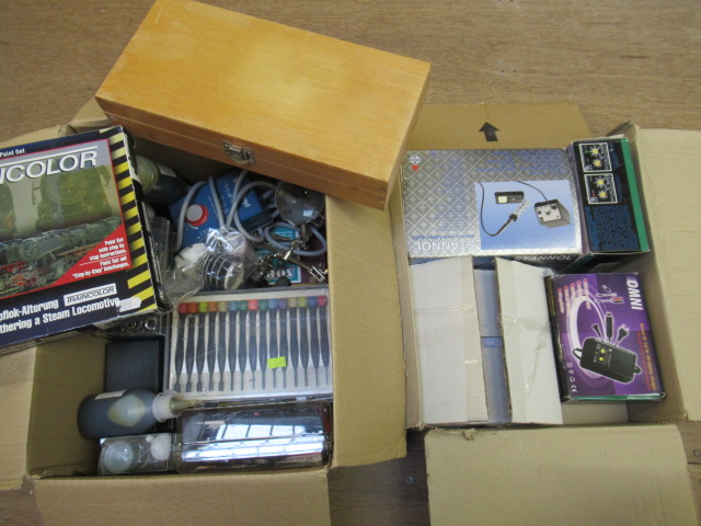 A quantity of railway paints model making tools including knife Image