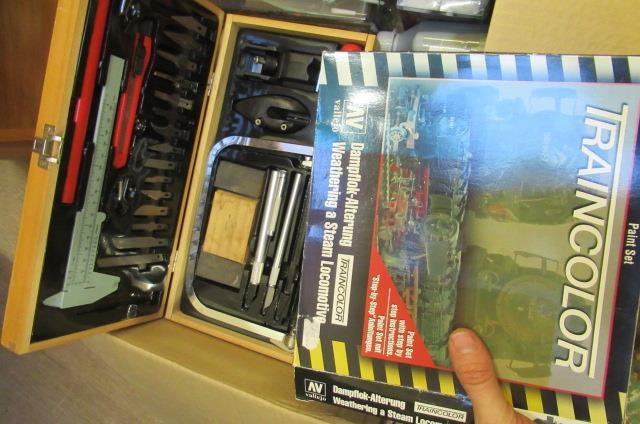 A quantity of railway paints model making tools including knife Image