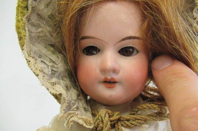 An Armand Marseille bisque socket head doll Image