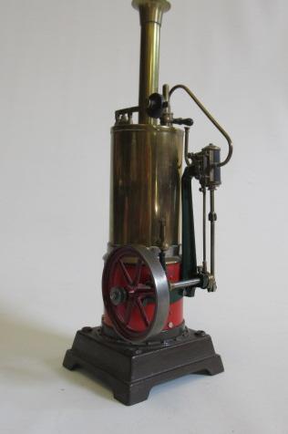 A single cylinder vertical toy steam engine fitted with water gauge Image