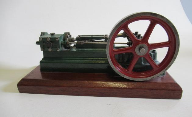 A horizontal signal cylinder mill engine finished in green/red Image
