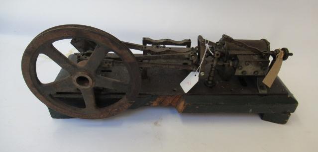 A single cylinder reversing horizontal mill steam engine fixed to a wooden base Image