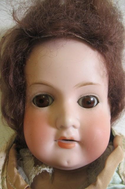 An Armand Marseille bisque shoulder head doll Image