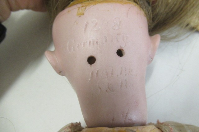 A Simon & Halbig bisque socket head doll Image