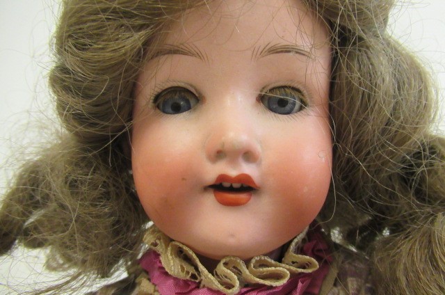 An Armand Marseille bisque socket head doll Image