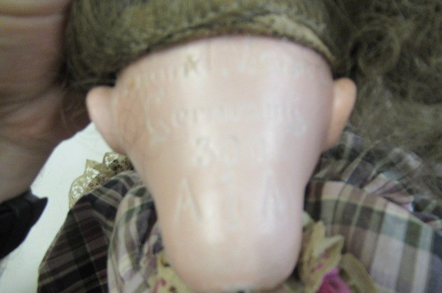 An Armand Marseille bisque socket head doll Image