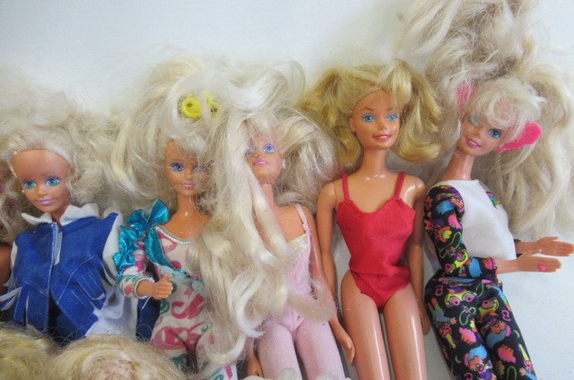 A Collection of Barbie dolls Image