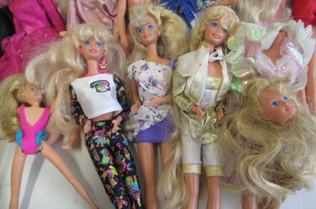 A Collection of Barbie dolls Image