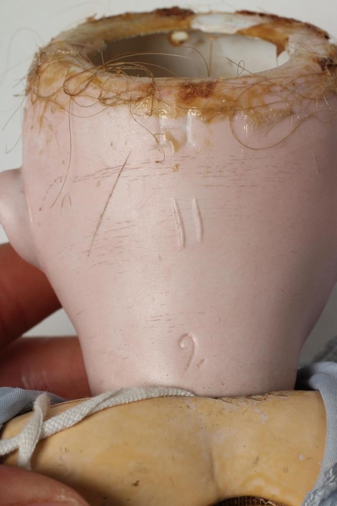 A Heinrich Handwerck bisque socket head doll Image