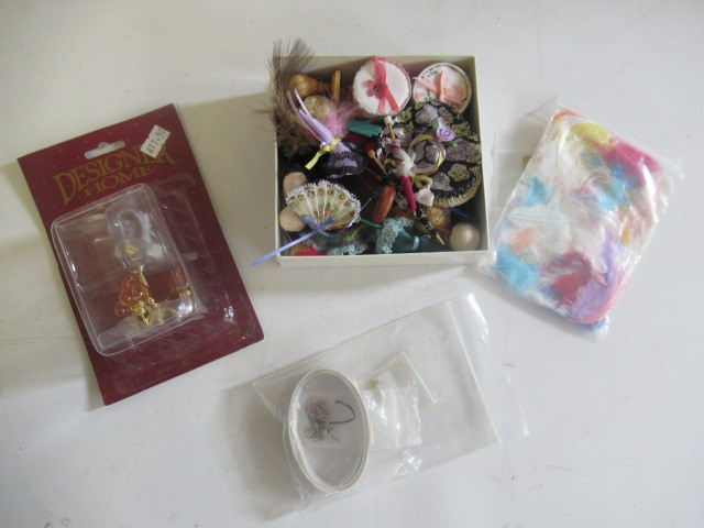 A box of doll's house furniture Image