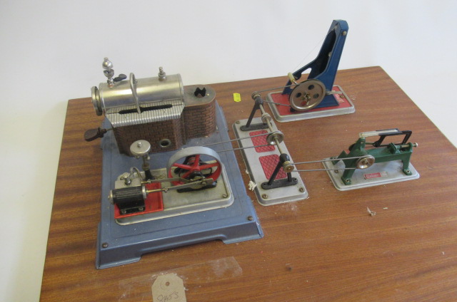 A Wilesco steam engine with two workshop tools and pulleys Image