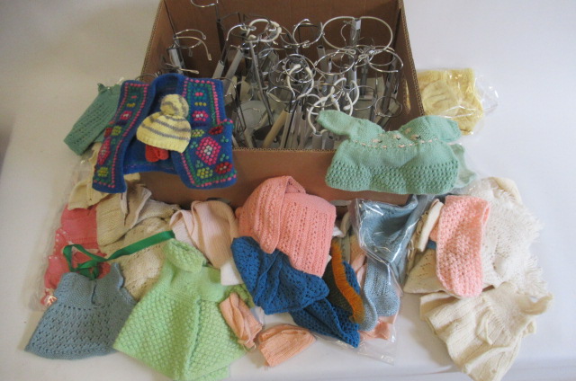 A quantity of mainly woollen dolls clothing Image