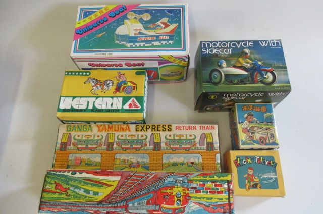 Modern issue clockwork toys made in China including Space Boat Image