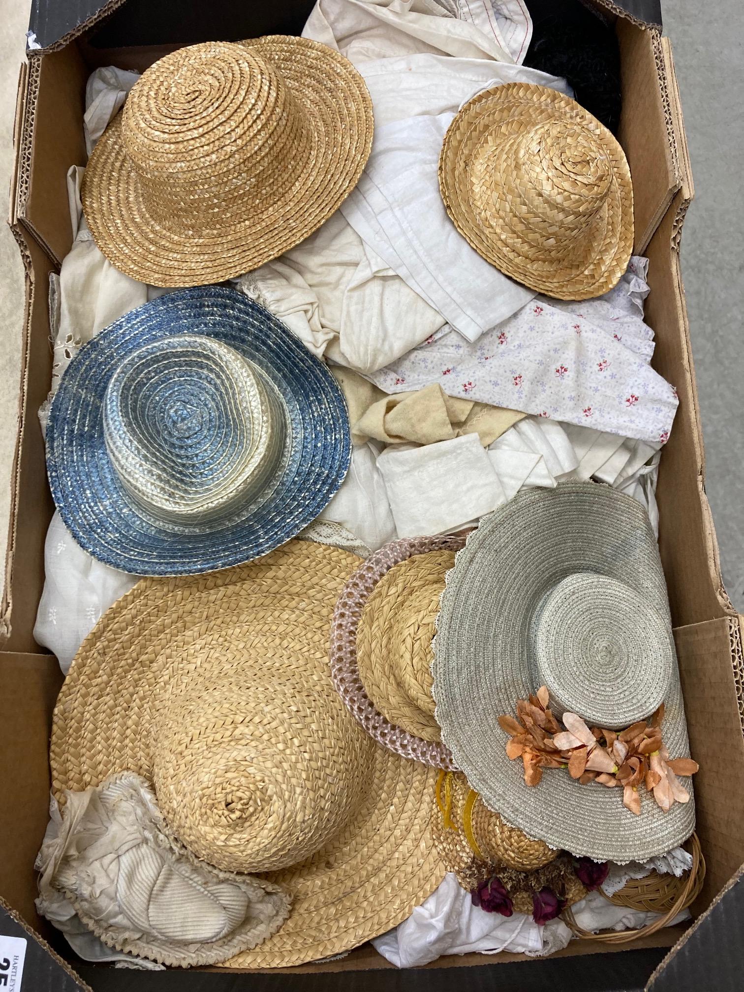 A quantity of dolls clothes and hats Image