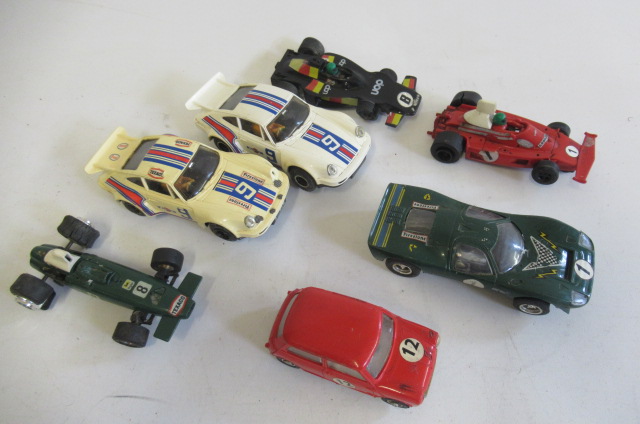 Seven playworn Scalextric racing cars including Porsche and Ford Image
