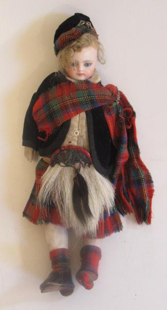 A bisque socket head Scottish boy doll Image