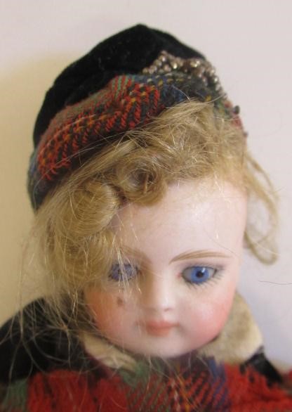 A bisque socket head Scottish boy doll Image