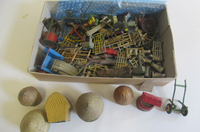 Farmyard equipment from various makers including hay stacks Image