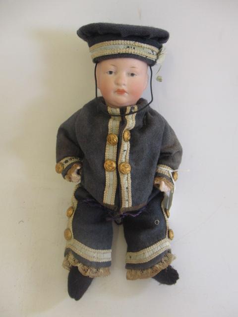 A Heubach bisque head solemn boy Image