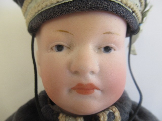 A Heubach bisque head solemn boy Image