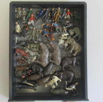 Zoo keepers and staff and a small quantity of zoo animals Image