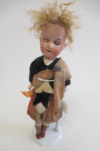 An Armand Marseille bisque socket head Scotch boy Image