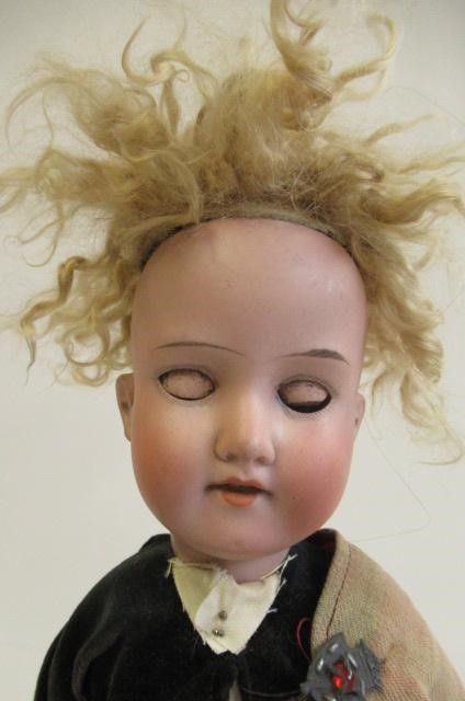 An Armand Marseille bisque socket head Scotch boy Image