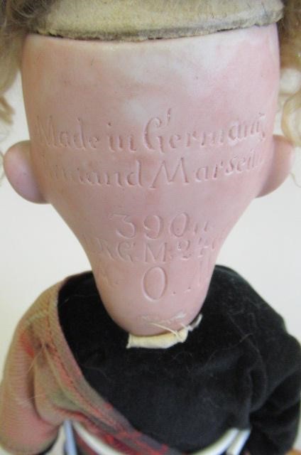 An Armand Marseille bisque socket head Scotch boy Image