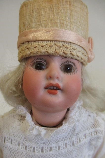 Two bisque socket head dolls, comprising a Franz Schmidt & Co. girl Image