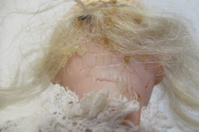 Two bisque socket head dolls, comprising a Franz Schmidt & Co. girl Image